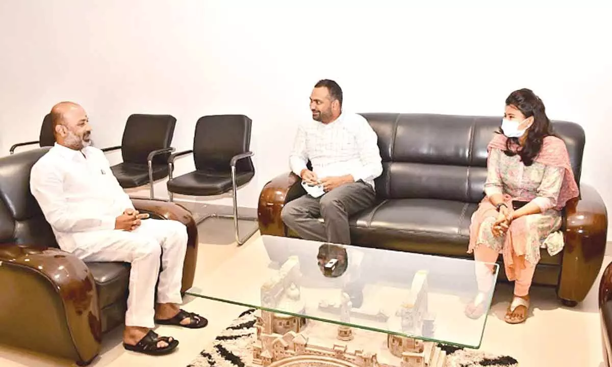 State BJP president Bandi Sanjay Kumar meeting district Collector RV Karnan in Karimnagar on Tuesday