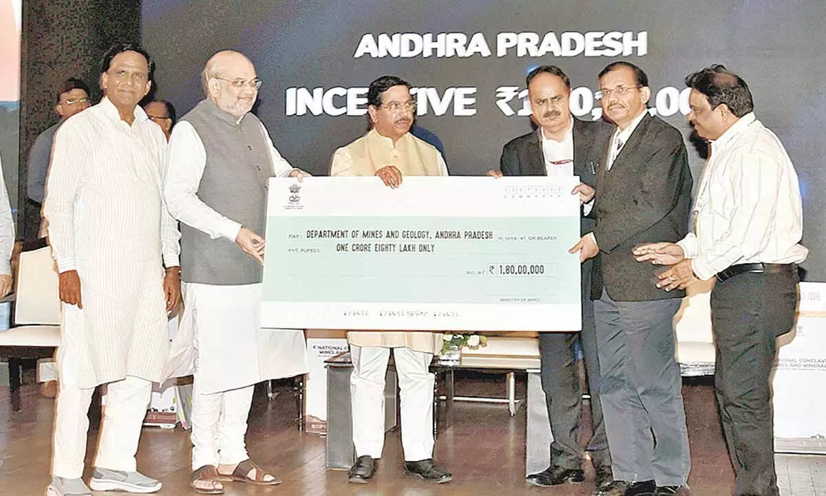 Union home minister Amit Shah presents award to Andhra Pradesh principal secretary, mines and geology, Gopal Krishna Dwivedi and director, mines and geology, G Venkata Reddy during the 6th National Conclave on Mines and Minerals, in New Delhi on Tuesday