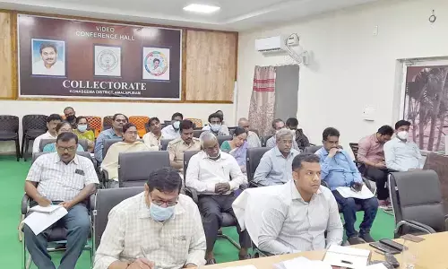 District Collector Himanshu Shukla attending a video conference with Chief Minister YS Jagan Mohan Reddy from his office in Amalapuram on Tuesday