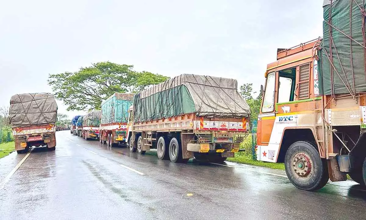 Several trucks have been stuck on National Highways due to no road connectivity for the last three days in Kothagudem district on  Wednesday