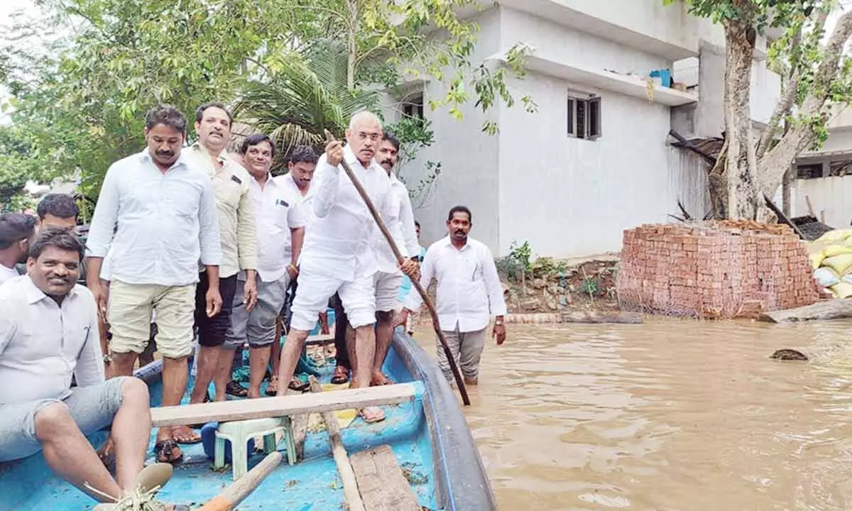 BC Welfare Minister C Venu Gopala Krishna visiting the flood affected areas and interacting with the victims at Kotipalli village on Wednesday