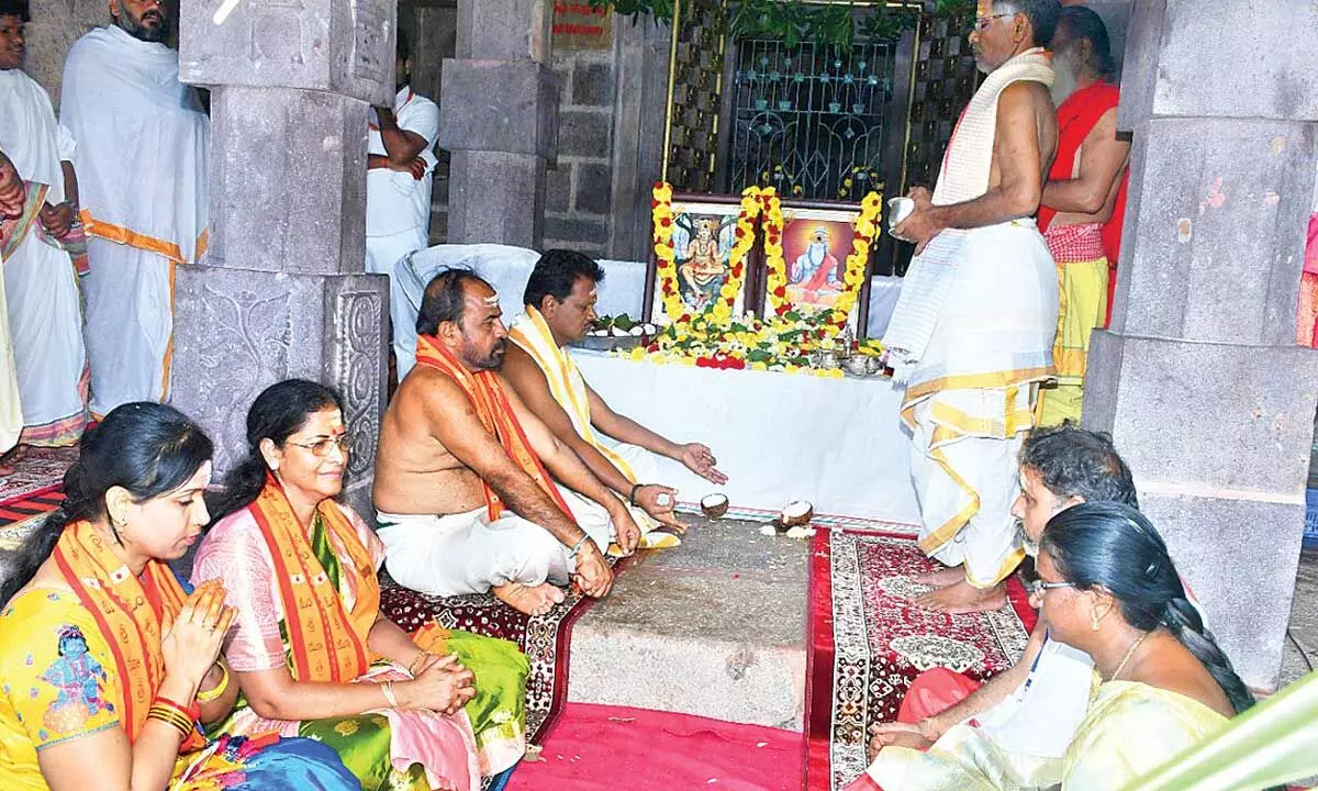 Srisailam Temple Executive Officer S Lavanna offering prayers to Vyasa Maharshi to mark the Guru Pournami at Srisailam temple on Wednesday.