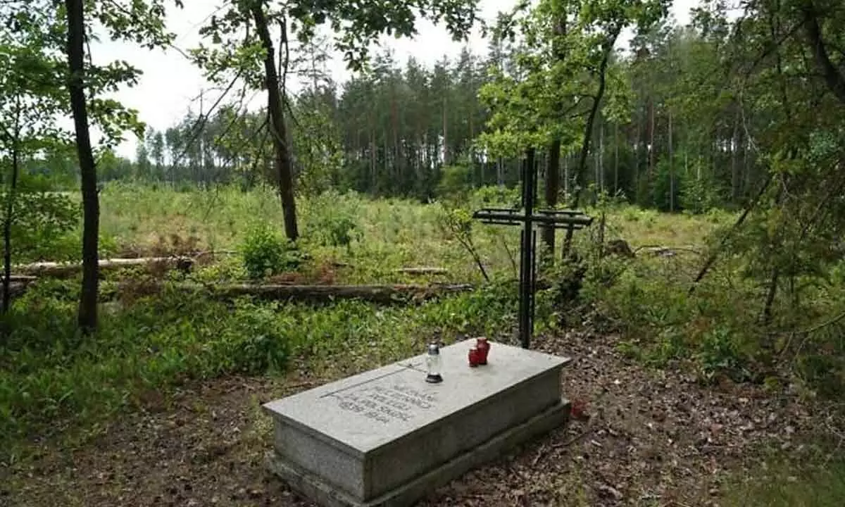 A symbolic grave in the Bialucki Forest near Ilowo on July 13, 2022 the site where the mass grave of about 8,000 Nazi victims from the nearby Soldau concentration camp in Dzialdowo was unearthed at the beginning of July 2022. (JANEK SKARZYNSKI / AFP)