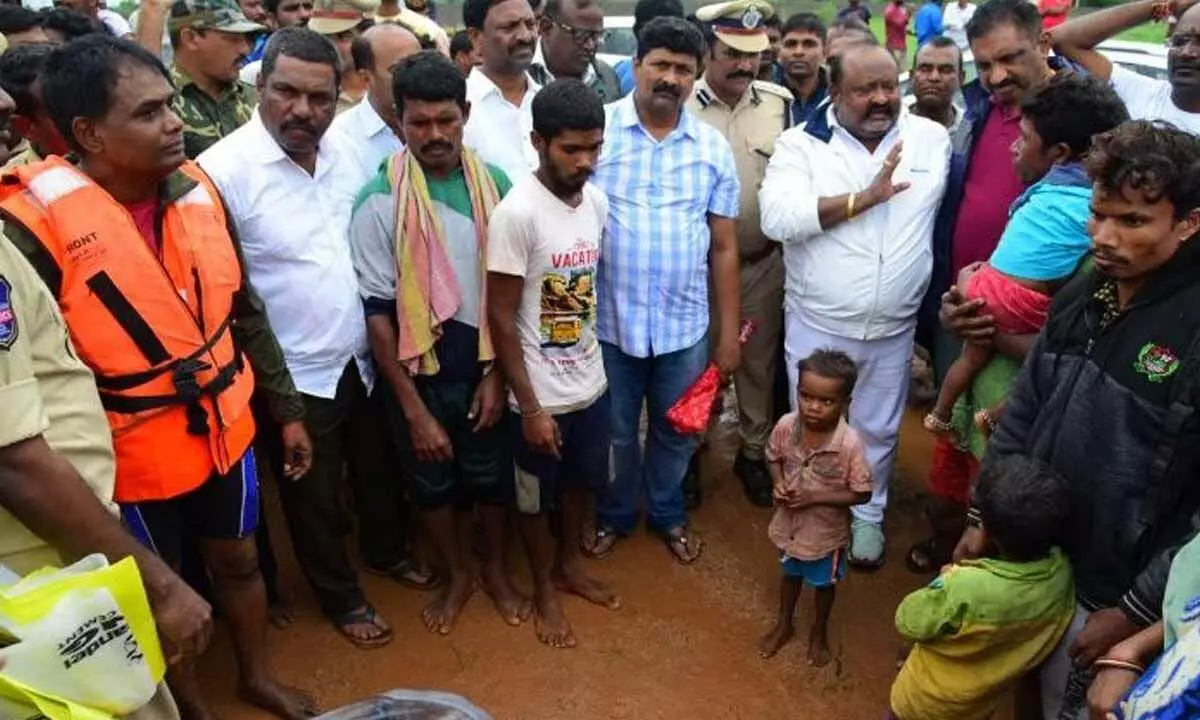 Ministers Koppula Eshwar and Gangula Kamalakar, former MP Vivek Venkataswamy, MLAs and officials visiting the flood affected areas at different places in combined Karimnagar district on Thursday