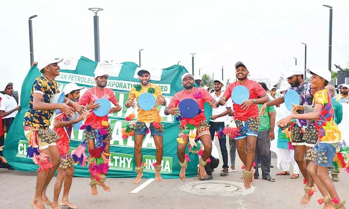 As part of the walkathon organised on the Beach Road, folk artistes perform Tappetagulu in Visakhapatnam  on Thursday