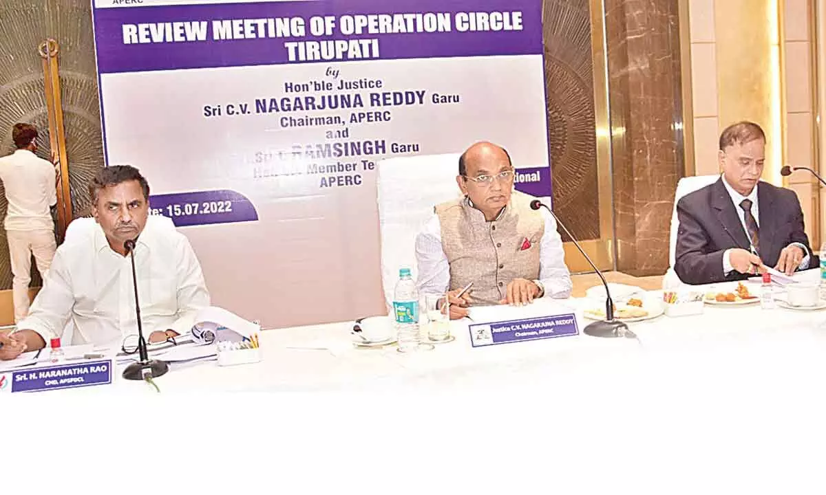 APERC chairman Justice C V Nagarjuna Reddy addressing the media in Tirupati on Friday. APSPDCL CMD H Haranatha Rao (left) and member of APERC Thakur Ram Singh are also seen.