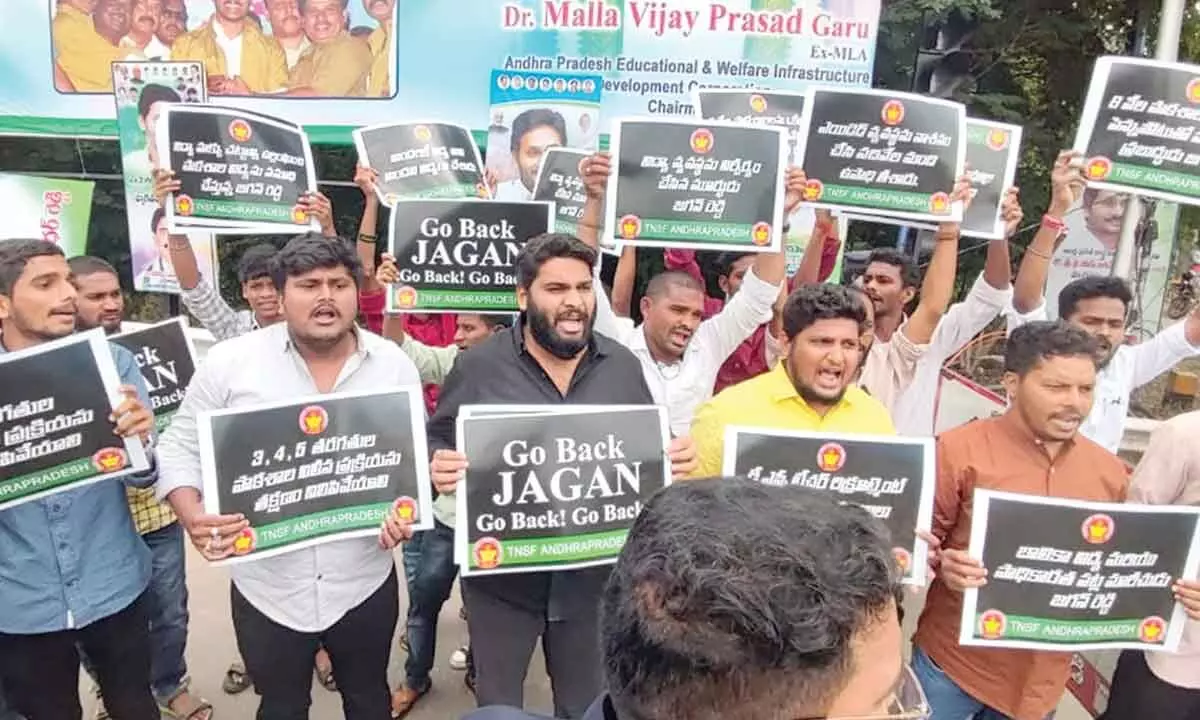 TNSF leaders staging a protest at Visakhapatnam Airport by displaying placards on Friday