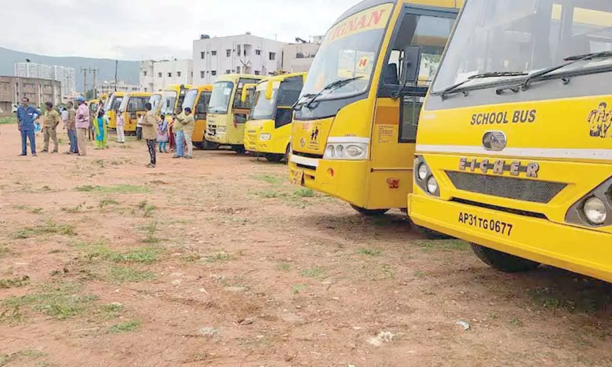 A fleet of buses from private educational institutions being pressed into service for the public meeting of Chief Minister YS Jagan Mohan Reddy in Visakhapatnam on Friday. 	Photos: Vasu Potnuru