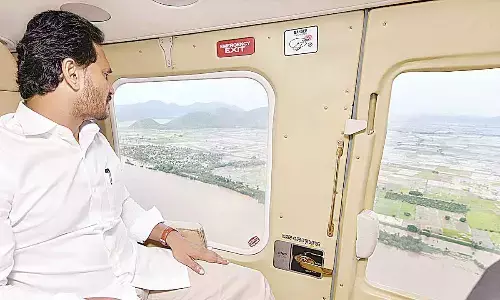 Chief Minister Y S Jagan Mohan Reddy conducting aerial survey of flood-affected areas on Friday