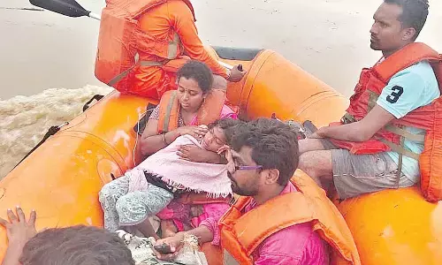 Rescue team shifting people to safer place from Tekula Boru village on Friday