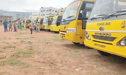 A fleet of buses from private educational institutions being pressed into service for the public meeting of Chief Minister YS Jagan Mohan Reddy in Visakhapatnam on Friday. 	Photos: Vasu Potnuru