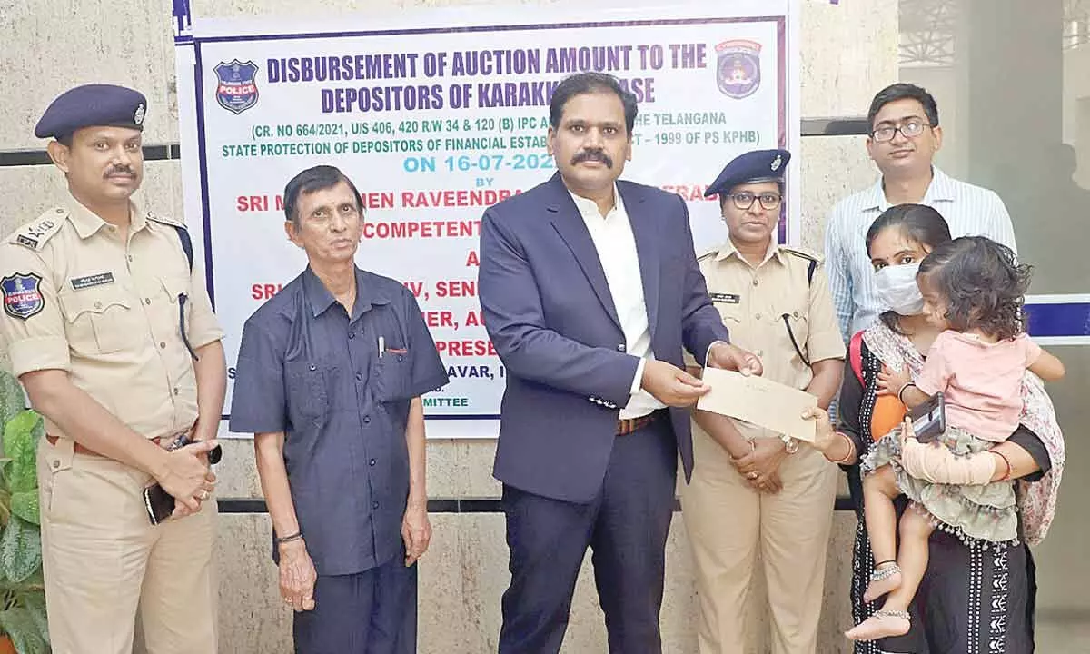 Cyberabad CP hands over cheques to Karakkaya fraud victims