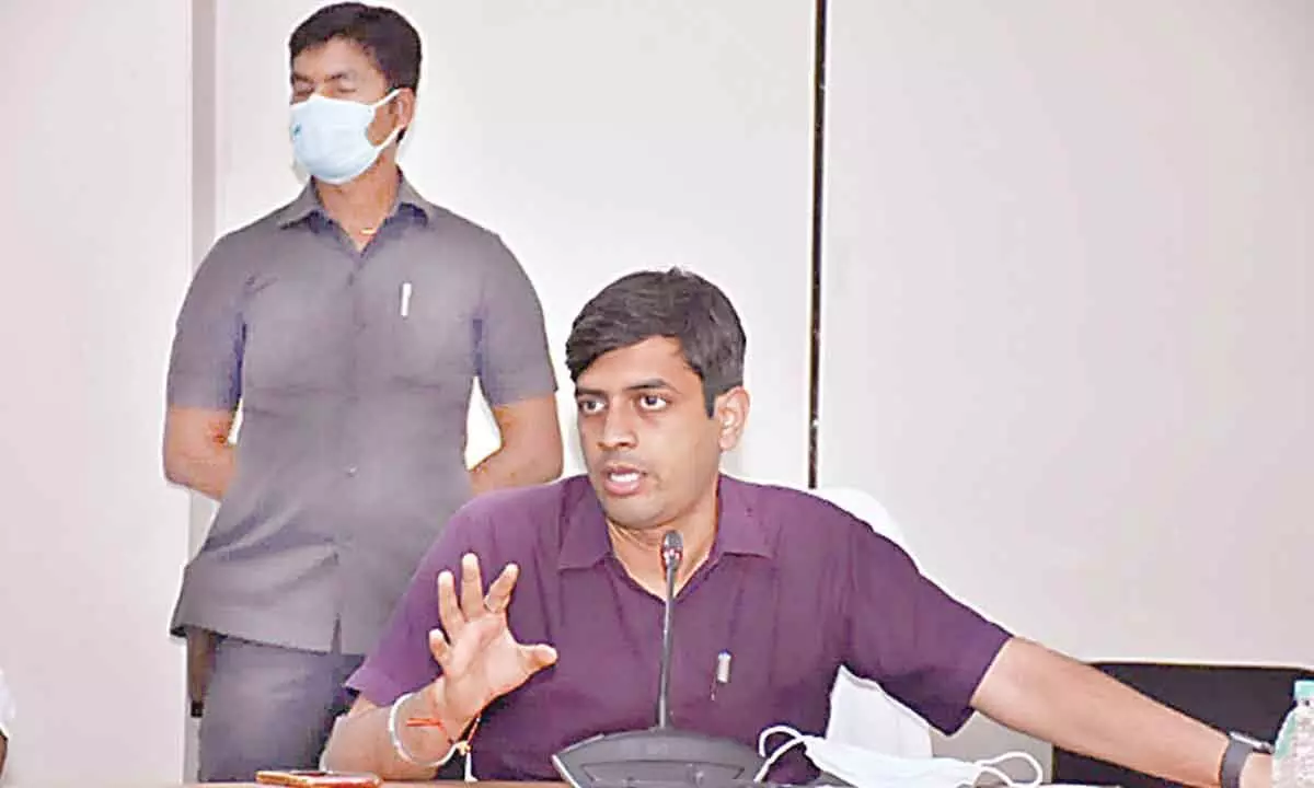 Collector Anurag Jayanthi speaking at a review meeting at Sircilla on Monday