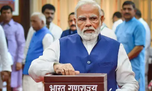 Prime Minister Narendra Modi casts his vote for the election of the President, at Parliament House in New Delhi on Monday