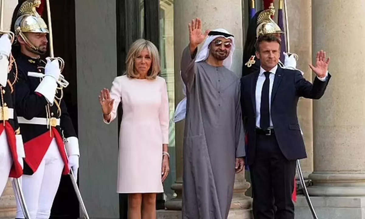 Frances President Emmanuel Macron, right, and his wife Brigitte Macron, left, welcome United Arab Emirates President Sheikh Mohammed Bin Zayed at the Elysee Palace in Paris. (Photo | AP)