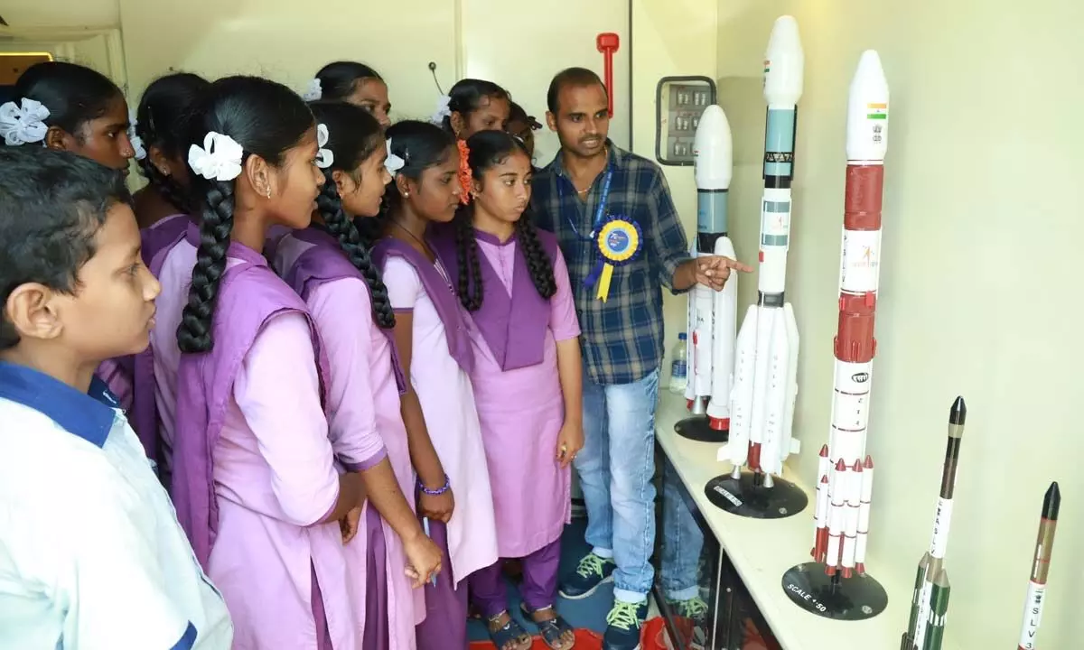 Students looking at miniature rocket models at the ‘Space on wheels’ mobile exhibition of SHAR in Tirupati on Tuesday