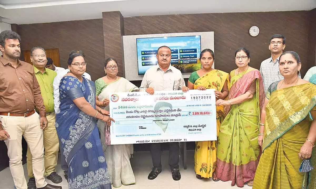 District Collector K Venkata Ramana Reddy releasing the mega cheque of over  Rs 2.89 crore in Tirupati on Tuesday. MEPMA PD Radhamma, DRDA officer Prabhavathi, DPO Rupa Rani and others are seen.