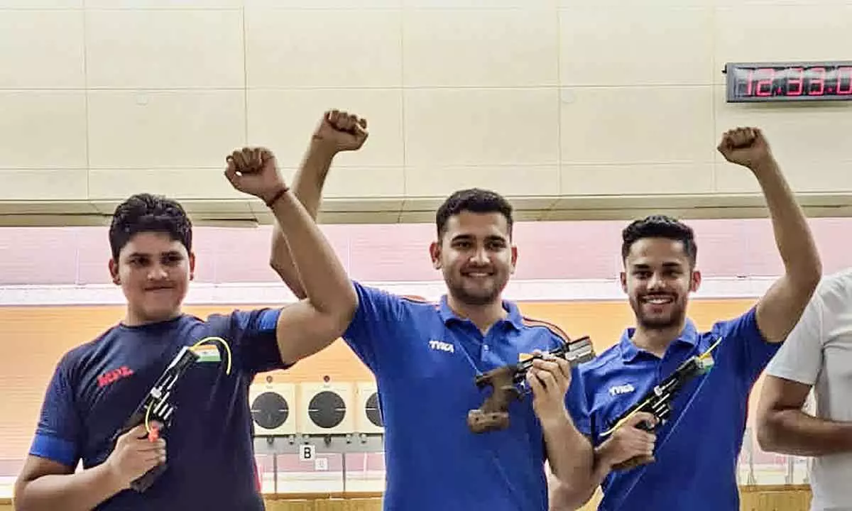 Indian sports shooters Sameer, Anish and Vijayveer Sidhu celebrate after winning the silver medal in the Men’s 25m Rapid Fire Pistol (RFP) Team event at the International Shooting Sport Federation (ISSF) World Cup 2022, in Changwon, South Korea