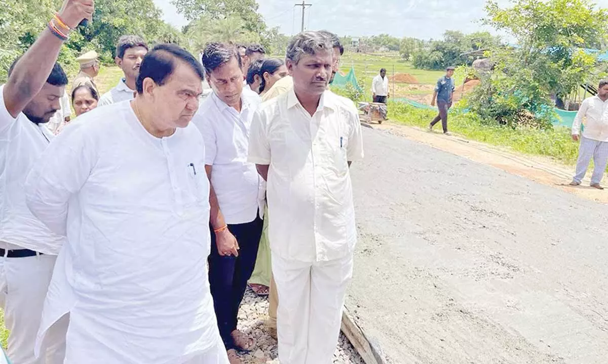 Speaker Pocharam Srinivas Reddy inspecting CC road works in Kamareddy district on Wednesday