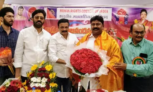 HRCI national vice-president Shaik Khalifatulla Basha being felicitated by the chief guests at a programme in Ongole on Wednesday