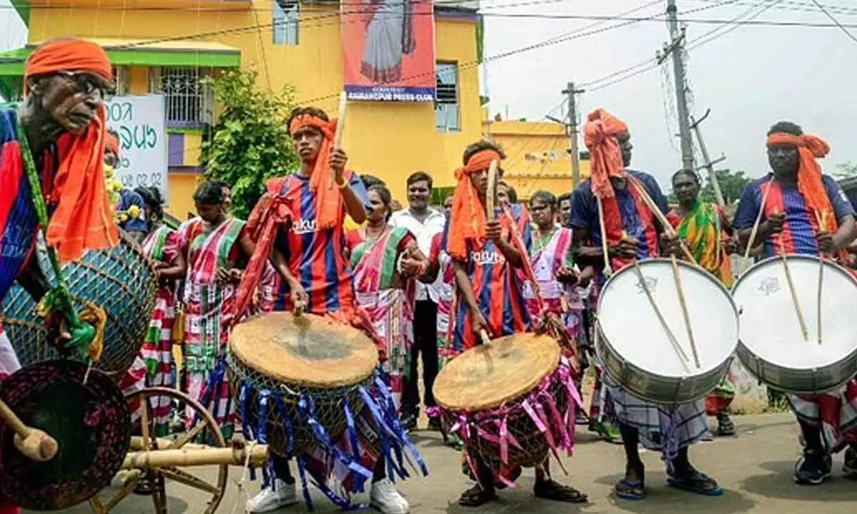 Tribal artists perform in anticipation of the results of Presidential Elections 2022 favouring Draupadi Murmu, near her residence in Rairangpur. (Photo | PTI)