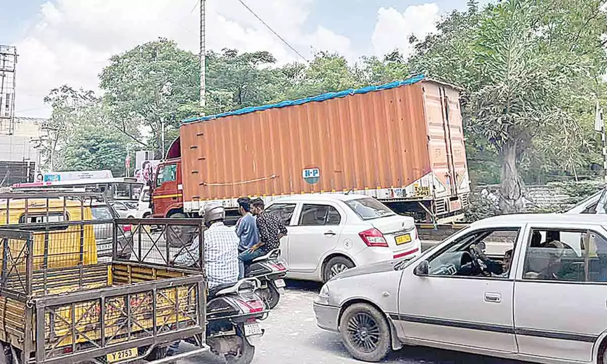Heavy vehicles ply on city roads despite restrictions