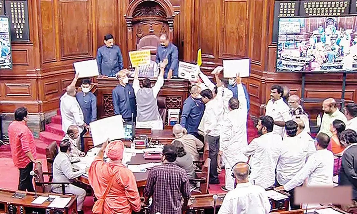 Opposition members protest in Rajya Sabha during the ongoing monsoon session of Parliament, in New Delhi on Thursday