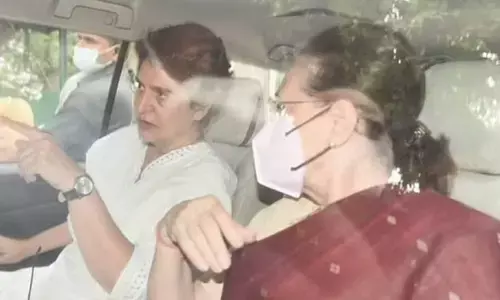 Congress interim president Sonia Gandhi, accompanied by her daughter Priyanka, leaves her residence for the ED office in New Delhi on Thursday