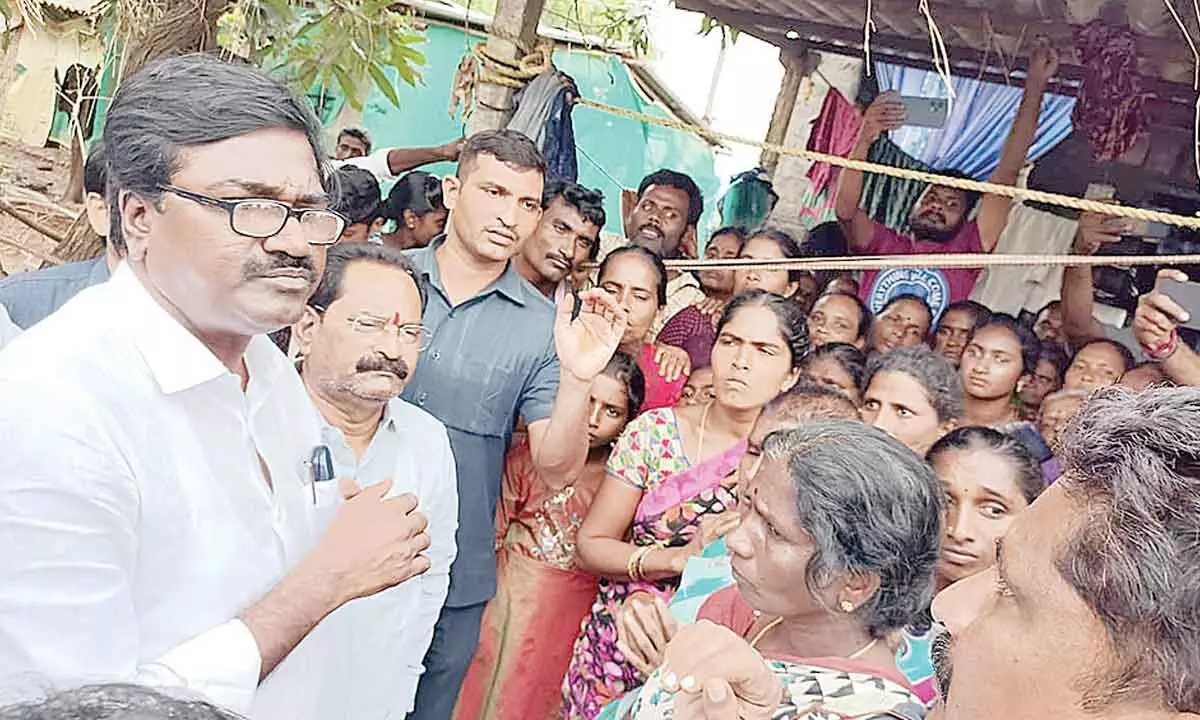 Transport Minister interacting with flood victims in tribal village of Dummagudem mandal on Friday