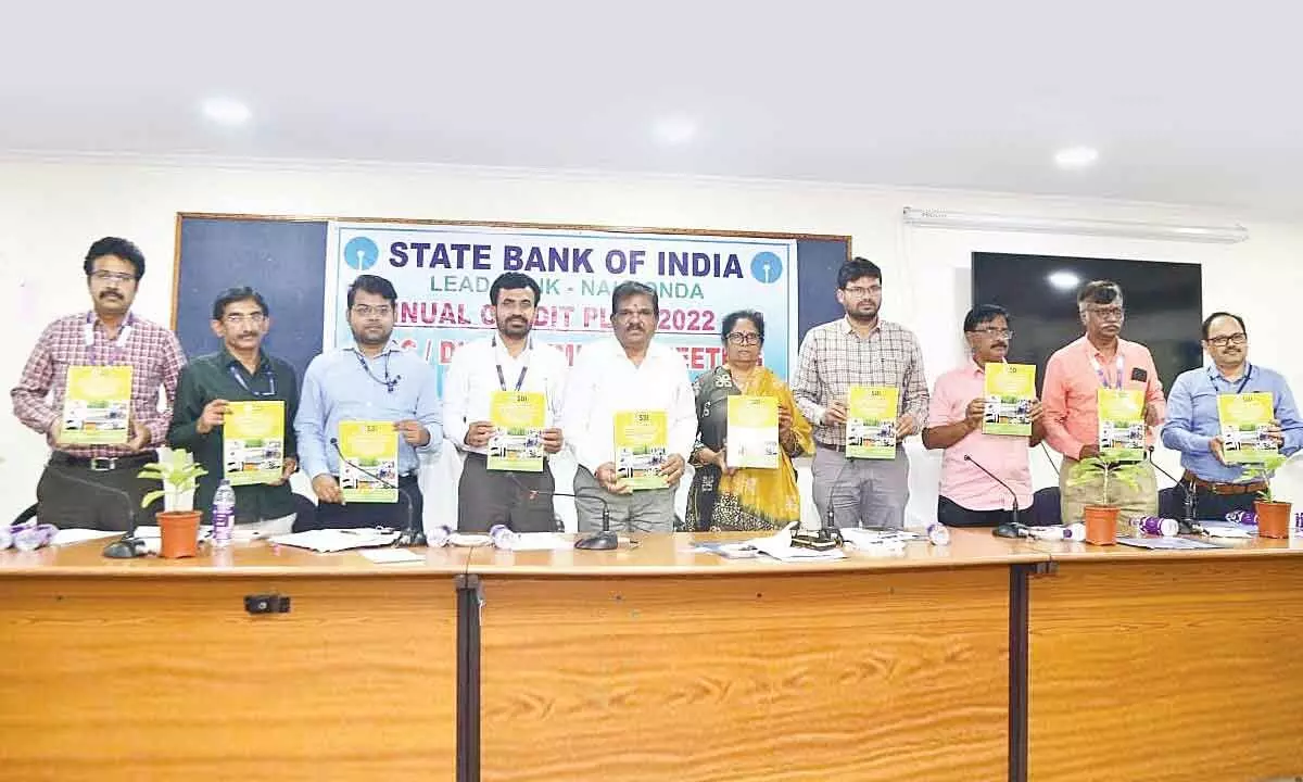 Additional Collector V Chandra Shekar along with district and bank officials releasing Annual Credit Plan 2022-23 at a meeting held at the Collectorate in Nalgonda on Friday
