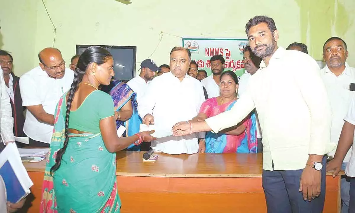 MLA Kandala Upender Reddy distributing CMRF and Kalyanalaxmi cheques to beneficiaries at his camp office in Palair on Friday