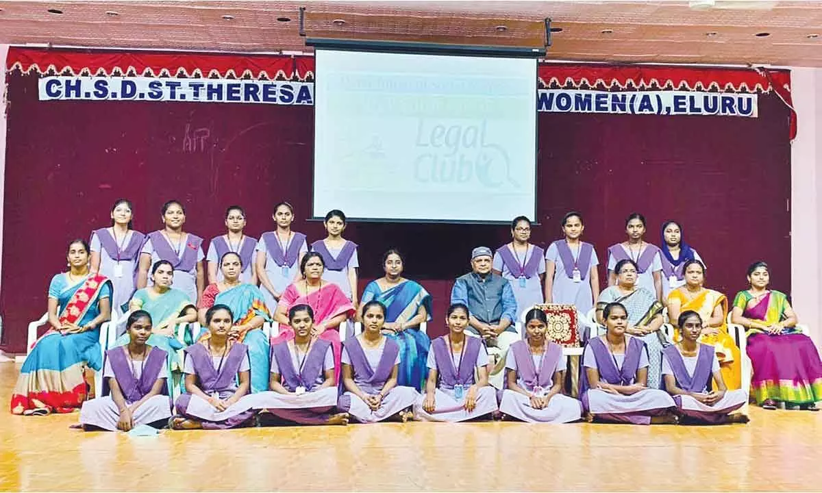Kuna Krishna Rao, Advocate and Resource Person for APHRDI, along with the staff and students of Ch SD St Theresas College for Women (A) at a programme in Eluru on Friday