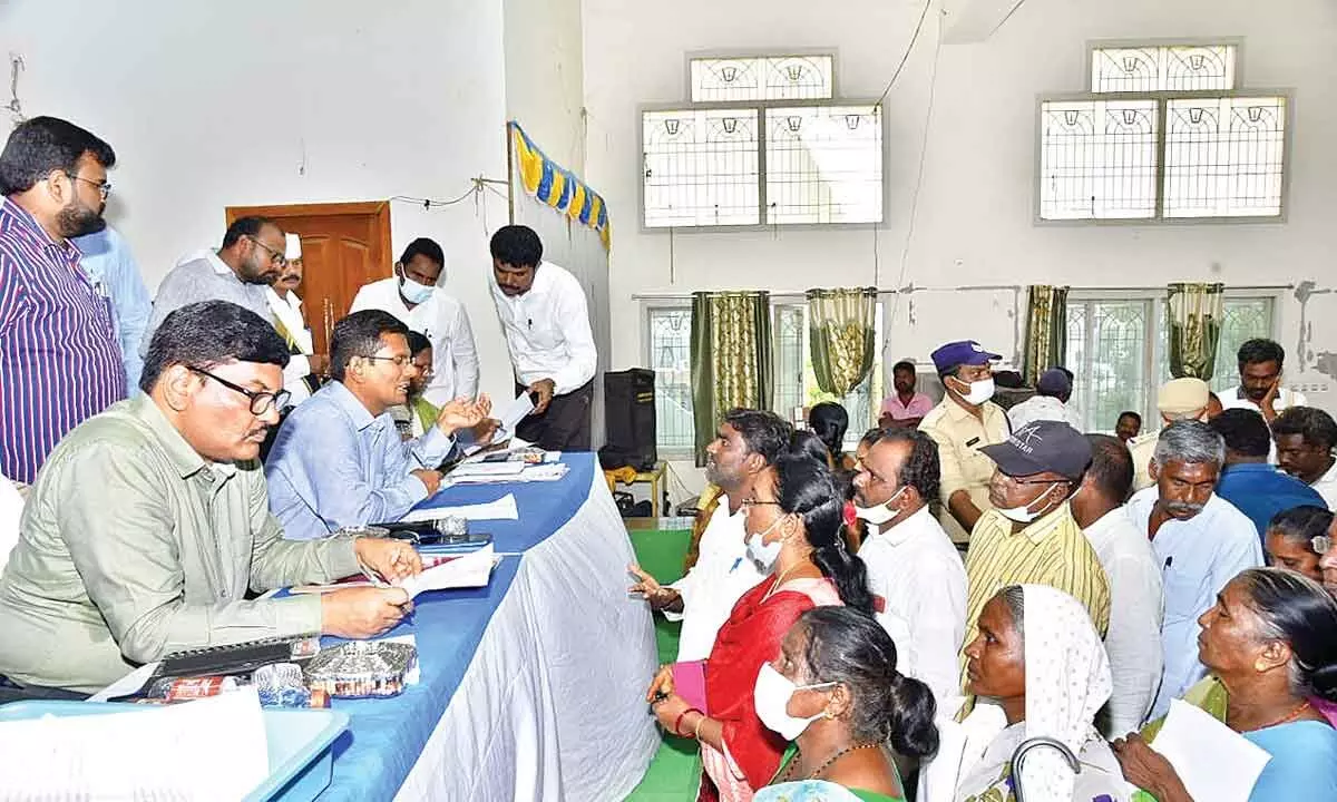Prakasam District Collector AS Dinesh Kumar receiving petitions from public at a special Spandana programme at BVSR Kalyana Mandapam in Chimakurthy on Friday