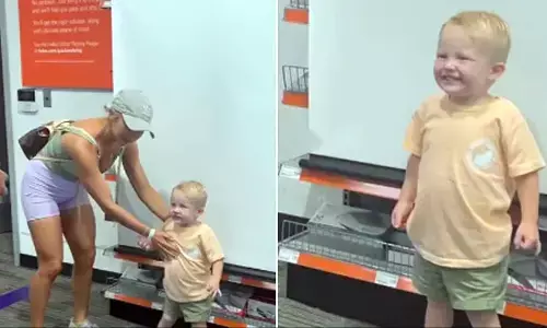 A trending video of a young boy having his passport photo taken is going viral.