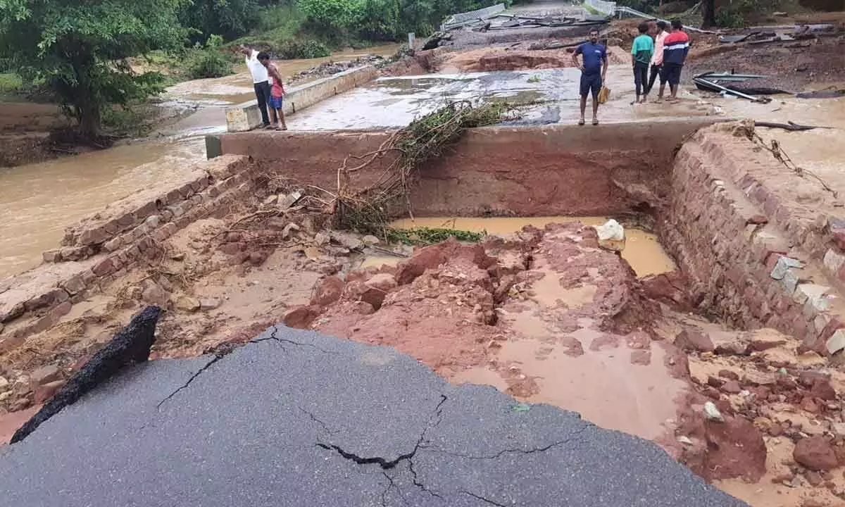 Warangal to Mulugu national highway has been washed away due to heavy rains near Tadvai Photo: G Shyam Kumar