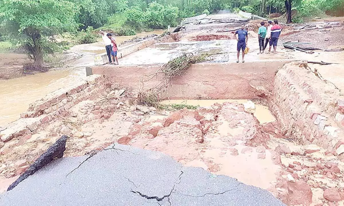 Warangal to Mulugu national highway has been washed away due to heavy rains near Tadvai Photo: G Shyam Kumar