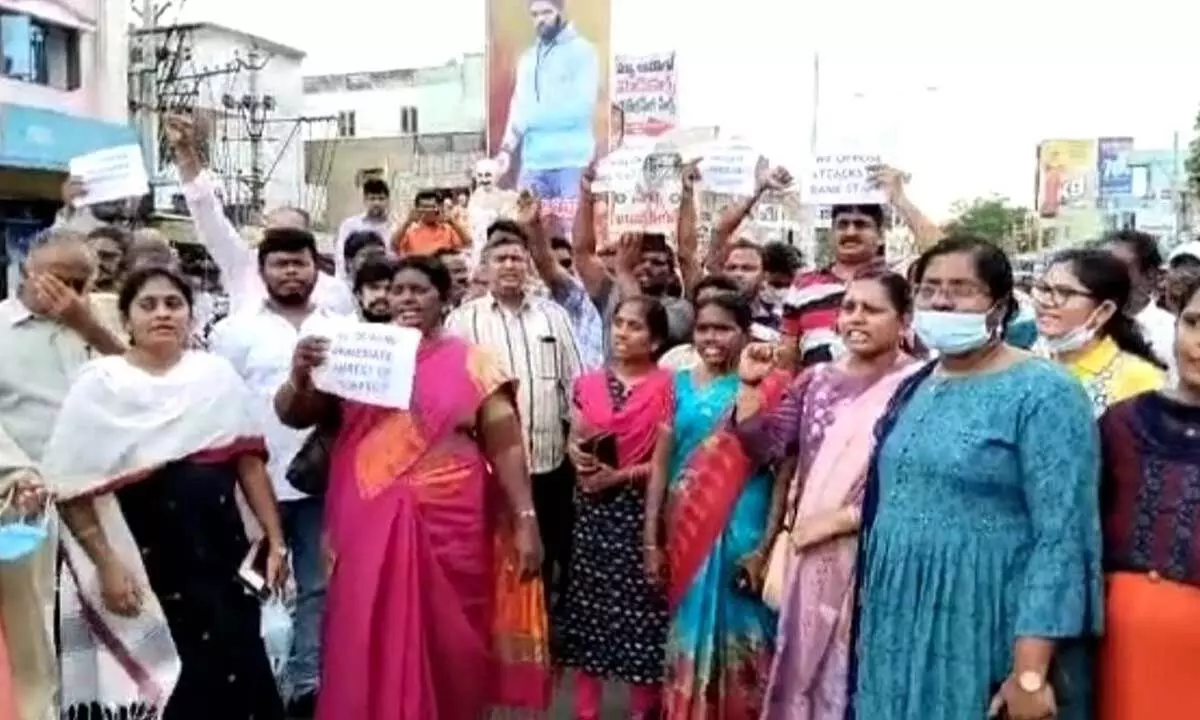 Holding placards UBI employees protesting in front of the bank in Amaravati on Saturday