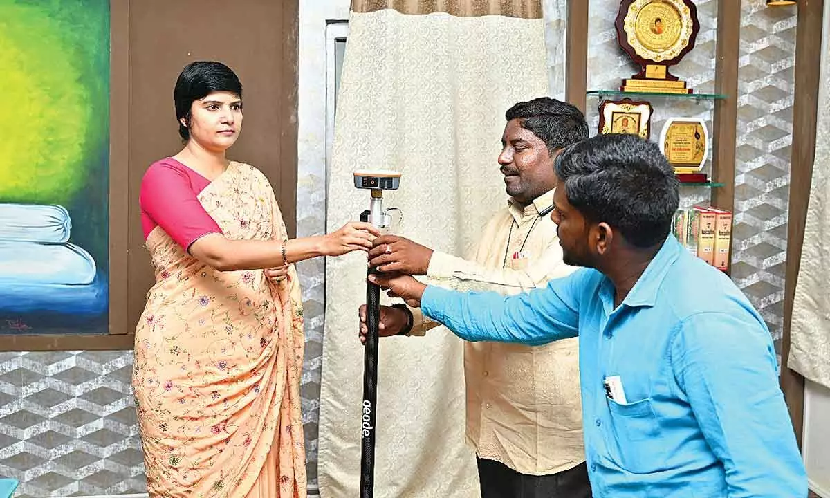Narayanpet District Collector Harichandana inspecting the new advanced land survey equipment on Sunday
