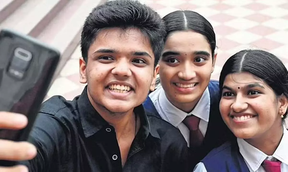 Adhish Joseph Shinu and Shivani S Prabhu who were placed second on the all-India merit list, along with Anagha M Nair, who bagged the all-India third merit position in the ISC examination, take a self