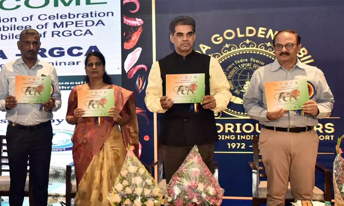 MPEDA Chairman KN Raghav releasing a souvenir after inaugurating a seminar along with Chief Executive of National Fisheries Development Board Dr Suvarna Chandrappagari and Commissioner of Fisheries K Kanna Babu in Vijayawada on Tuesday