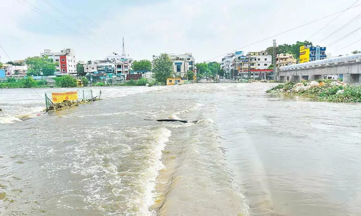 Overflowing rainwater forced authorities to close the Moosarambagh bridge in Malakpet on Wednesday Photo: Adula Krishna