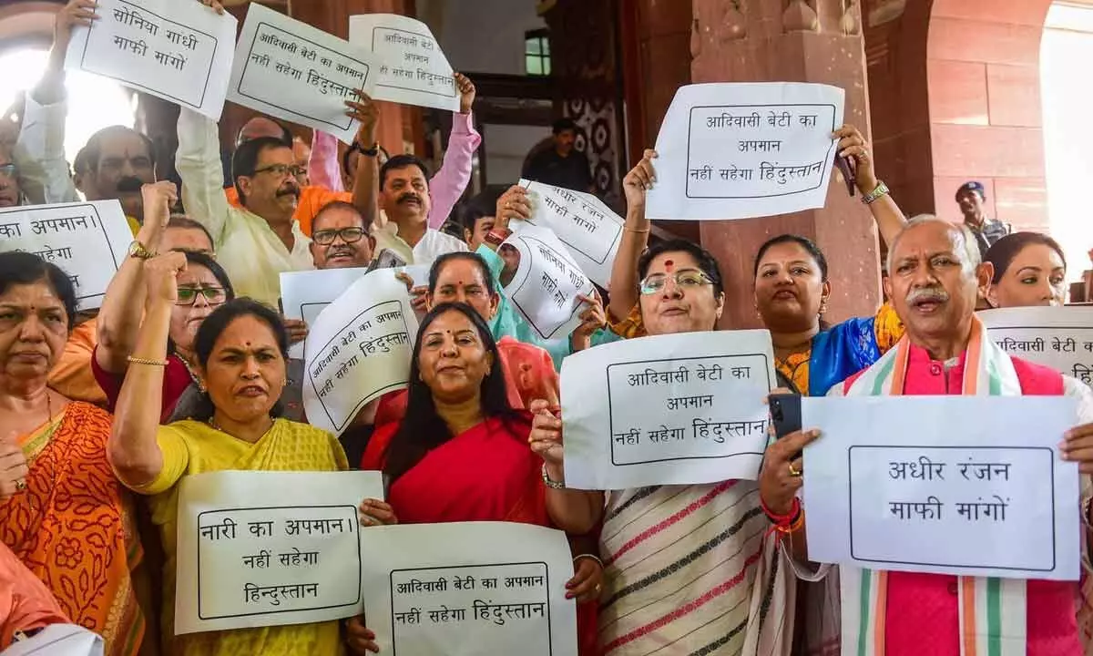 BJP MPs during a protest against Congress leader Adhir Ranjan Chowdhurys remarks on President Droupadi Murmu, at Parliament House, in New Delhi on  Thursday