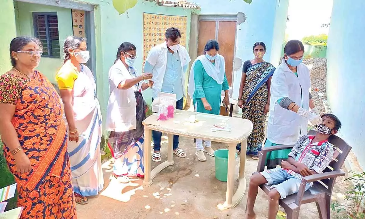 Medical staff conducting Covid test on students at Kodicharla school on friday