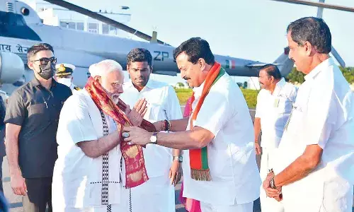 BJP national co-In-charge of Tamil Nadu Ponguleti Sudhakar Reddy welcoming Prime Minister Narendra Modi at Chennai Airport on Friday