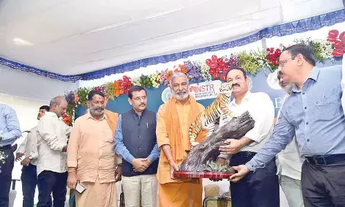 Minister for environment and forests Peddireddi Ramachandra Reddy taking part in the International Tiger Day celebrations at SV Zoo Park in Tirupati on Friday
