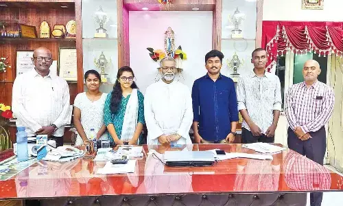 Andhra Loyola College Principal Fr Kishore, coordinator Dr G Sahaya Bhaskaran and placement cell member Dr Rajeev Kumar with students, who got placements, at Andhra Loyola College in Vijayawada on Friday