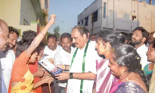 Ongole MLA Balineni Srinivasa Reddy interacting with locals as part of ‘Gadapa Gadapaku Mana Prabhutvam’ programme in Ongole on Friday