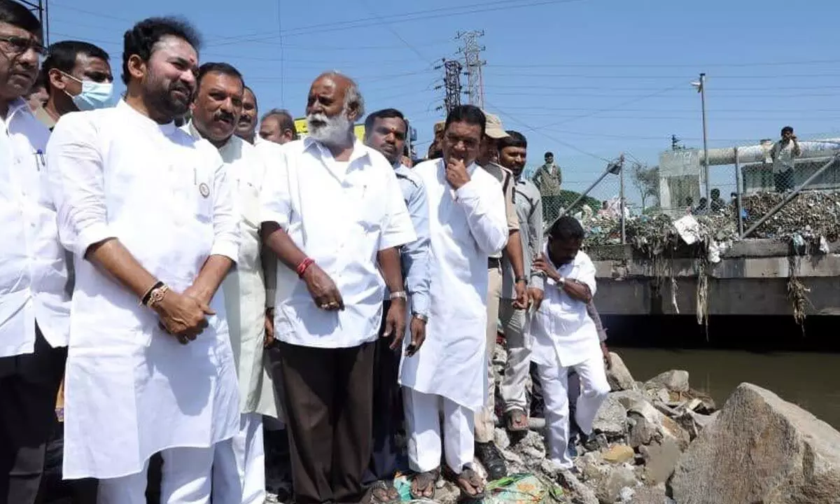 Union Minister G Kishan Reddy inspecting the flood-effected Moosarambagh near Musi River bridge in Hyderabad on Saturday