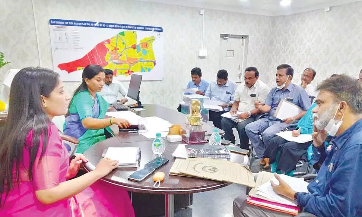 Mayor Dr R Sirisha and Municipal Commissioner Anupama Anjali holds a review with municipal officials at municipal office in Tirupati on Saturday.