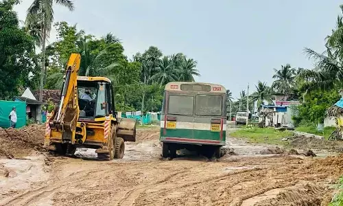 RTC bus traveling on muddy road between Rajamahendravaram and Seethanagaram